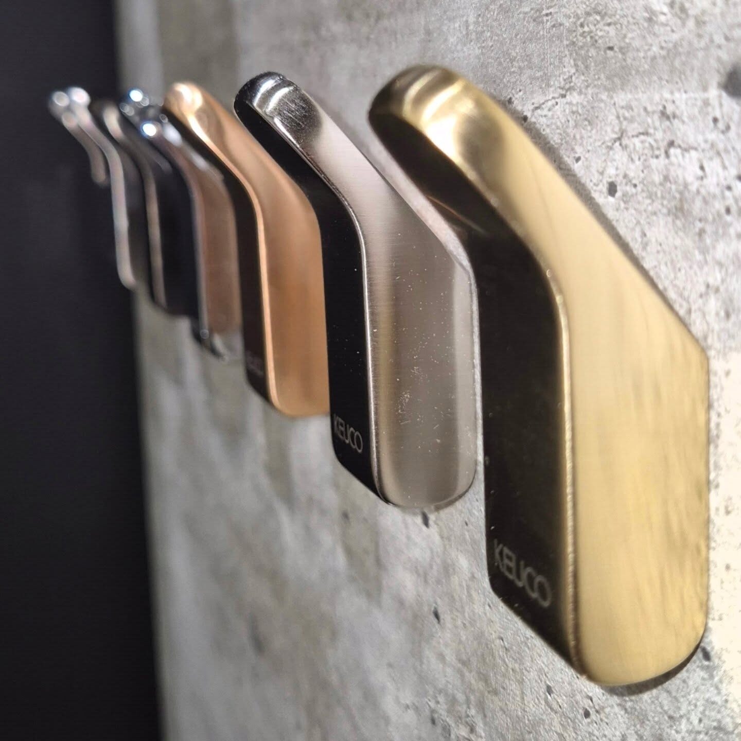 Brassware finish samples in brushed gold, bronze and black